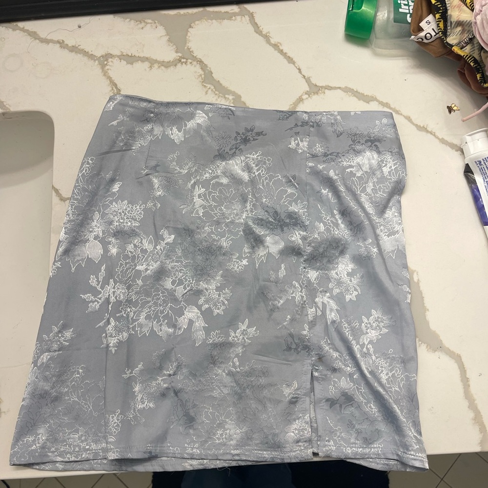 This is a silk (small)dress with floral like print